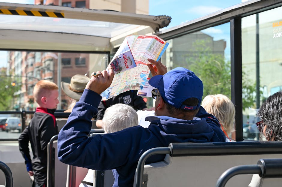 Tourists explore Valencia on an open-top bus tour, highlighting city sights and attractions.